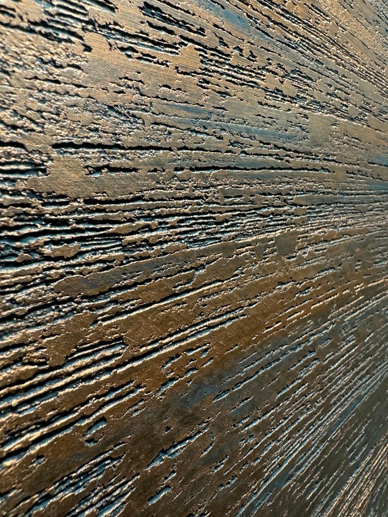 This dragged finish with a copper tone adds style to any area